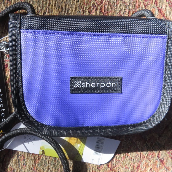 Sherpani Handbags - Sherpani purple RFID crossbody small bag, nwt Sherpani Handbags - Sherpani purple RFID crossbody small bag, nwt